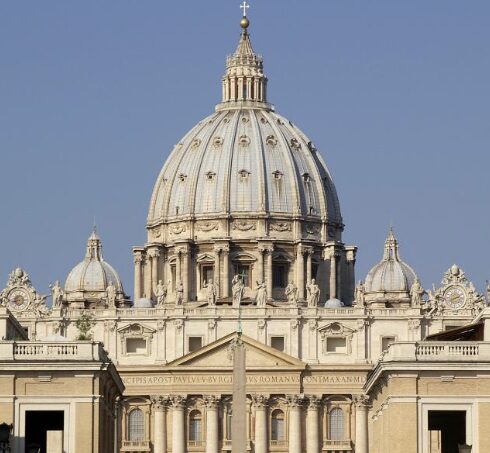Front view of St. Peter's Basilica in Vatican City, featuring the grand dome and ornate façade.